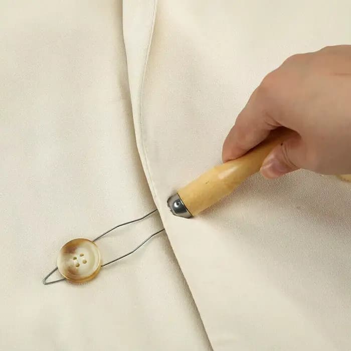 Bouton d'aide à la fermeture éclair à une main