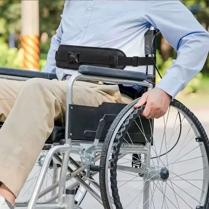 Ceinture de positionnement réglable pour fauteuil roulant